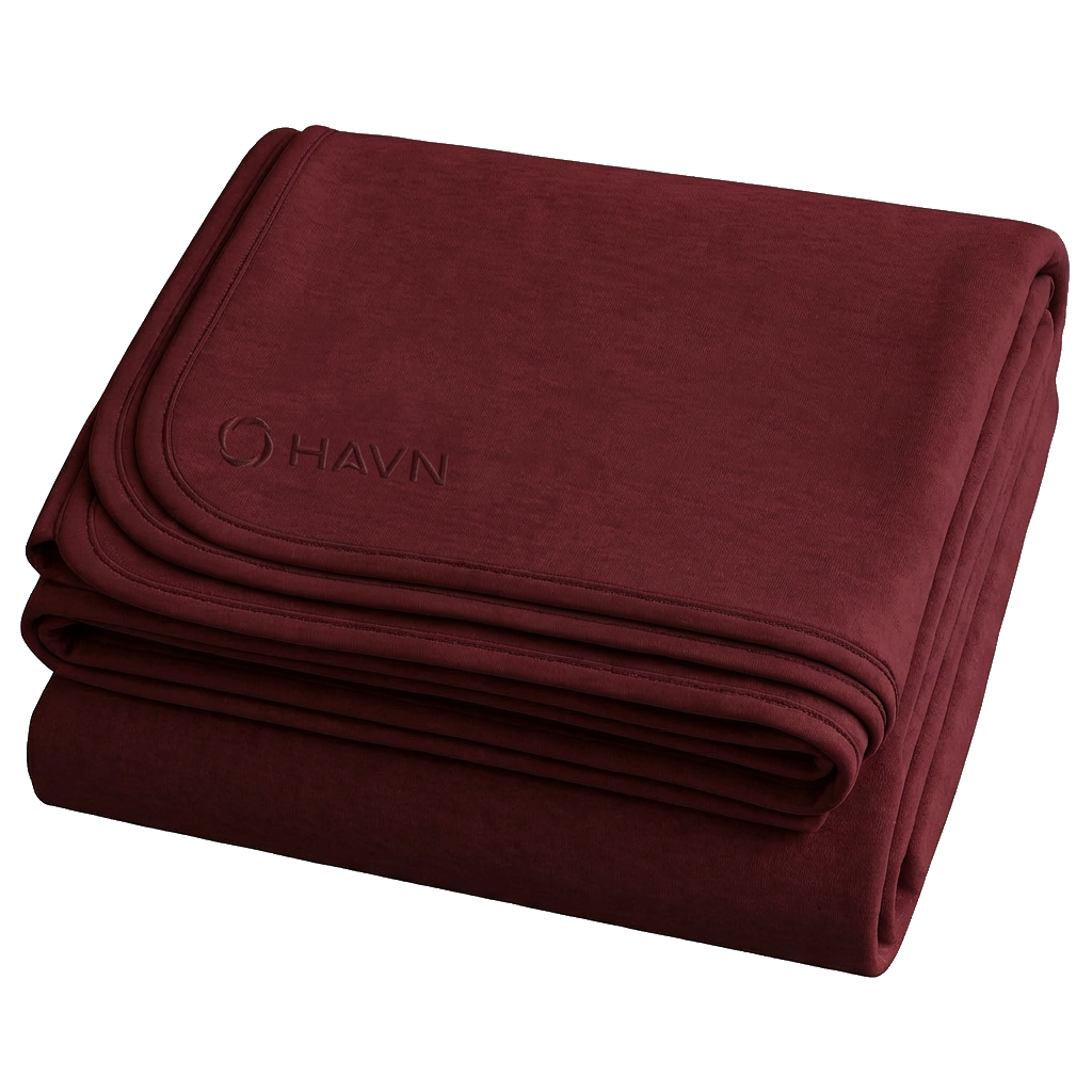 HAVN WaveStopper™ Blanket folded in burgundy, showing the brand logo on the top layer against a white background.