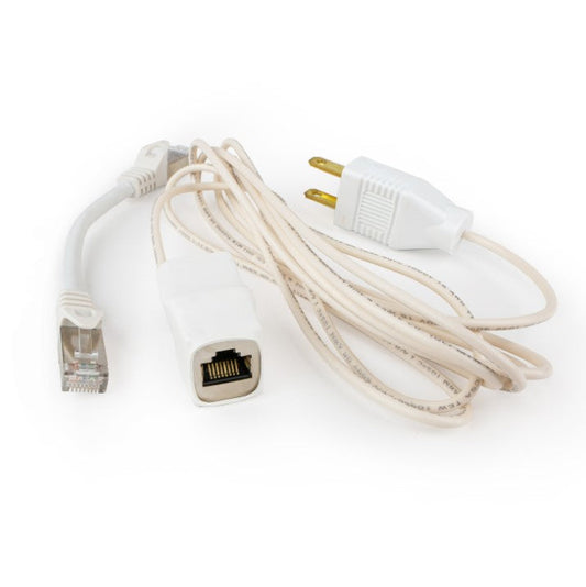 White grounding adapter with its Ethernet port facing forward, beside the short patch cable and the coiled grounding cord.