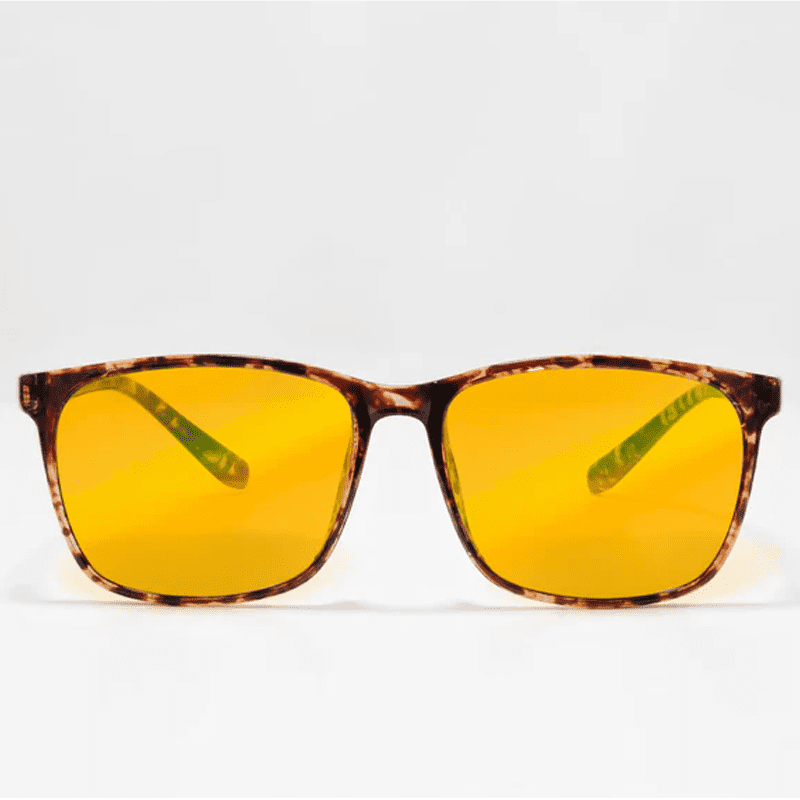 Ocushield Amber blue light glasses with tortoiseshell brown frames and yellow-tinted lenses, front view against white background.