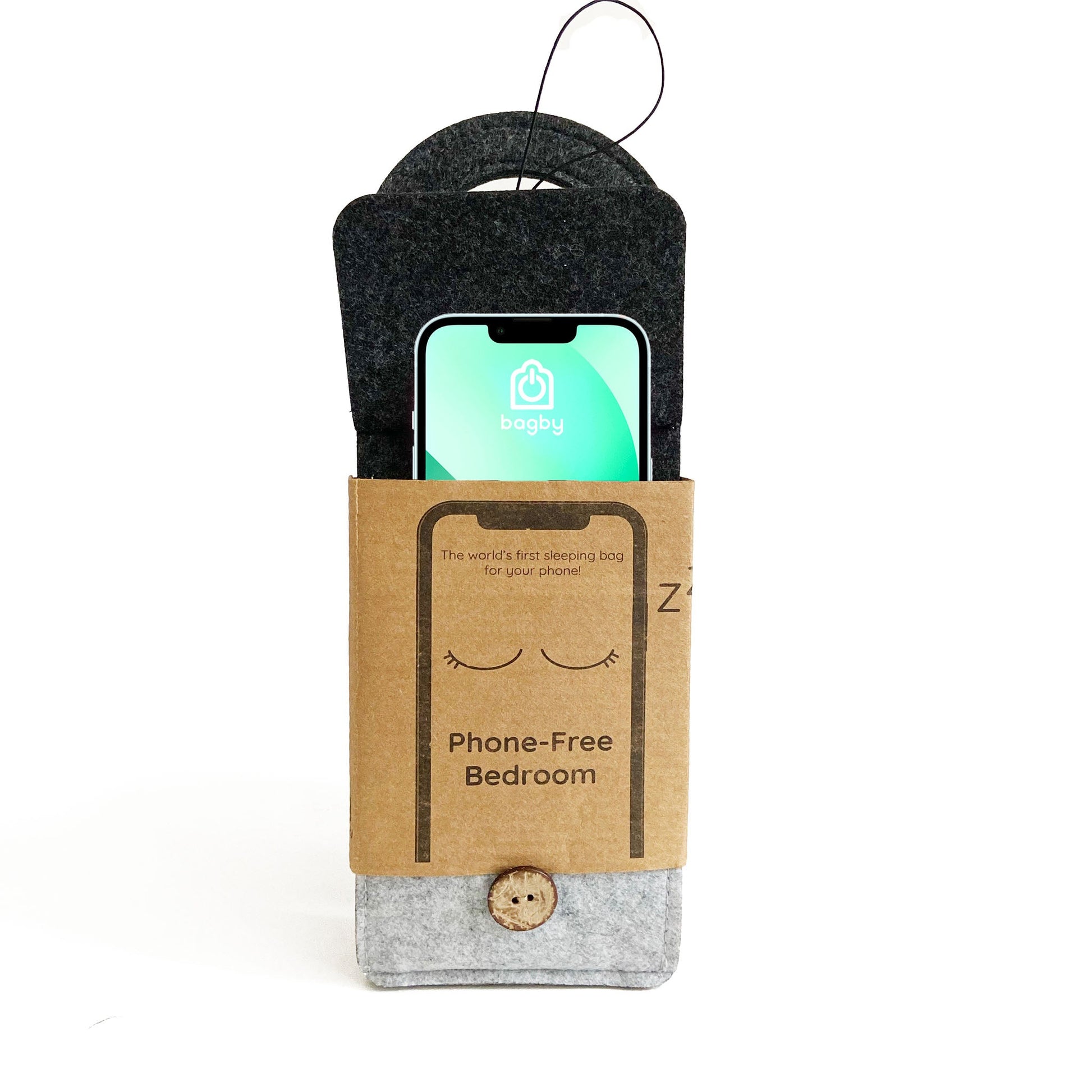 Bagby phone sleeping bag displayed in packaging, showing charcoal felt pouch with phone inside and "Phone-Free Bedroom" labeled box.