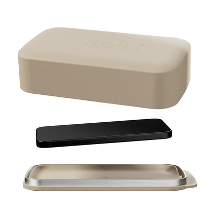 Sand-colored Bagby Stolp Faraday phone box shown open with its lid, metal-rimmed tray and a black phone laid between them on white.