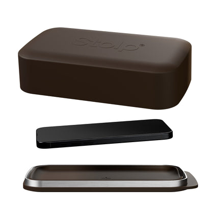 Brown Bagby Stolp Faraday phone box shown open with its lid, metal-rimmed tray and a black phone laid between them on white.