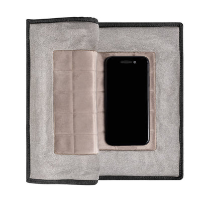 PoM Shield ORIGINAL Faraday cage open with smartphone inside protective pouch, top view.