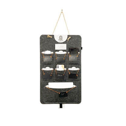 Dark charcoal Bagby FAMILY organizer with six named phone pockets and a lower pocket holding a white tablet.