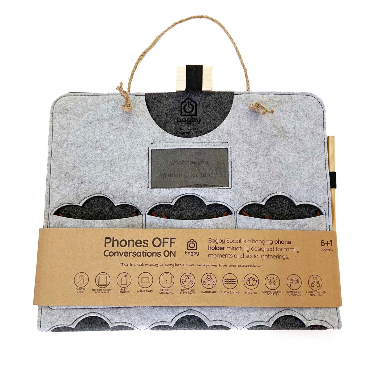 Light gray Bagby FAMILY organizer folded with its kraft band, showing empty cloud-shaped phone pockets and a rope hanger.