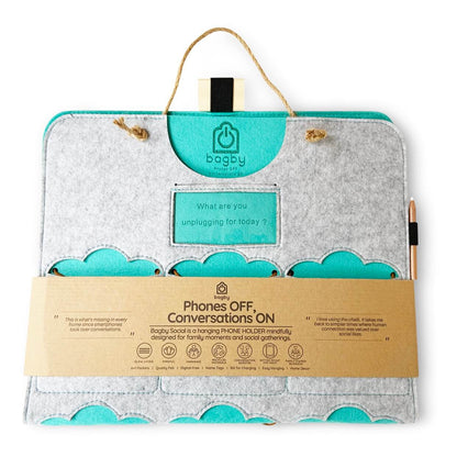 Light gray Bagby FAMILY organizer with teal pocket accents, folded in its kraft packaging band with rope hanger and chalk pencil.