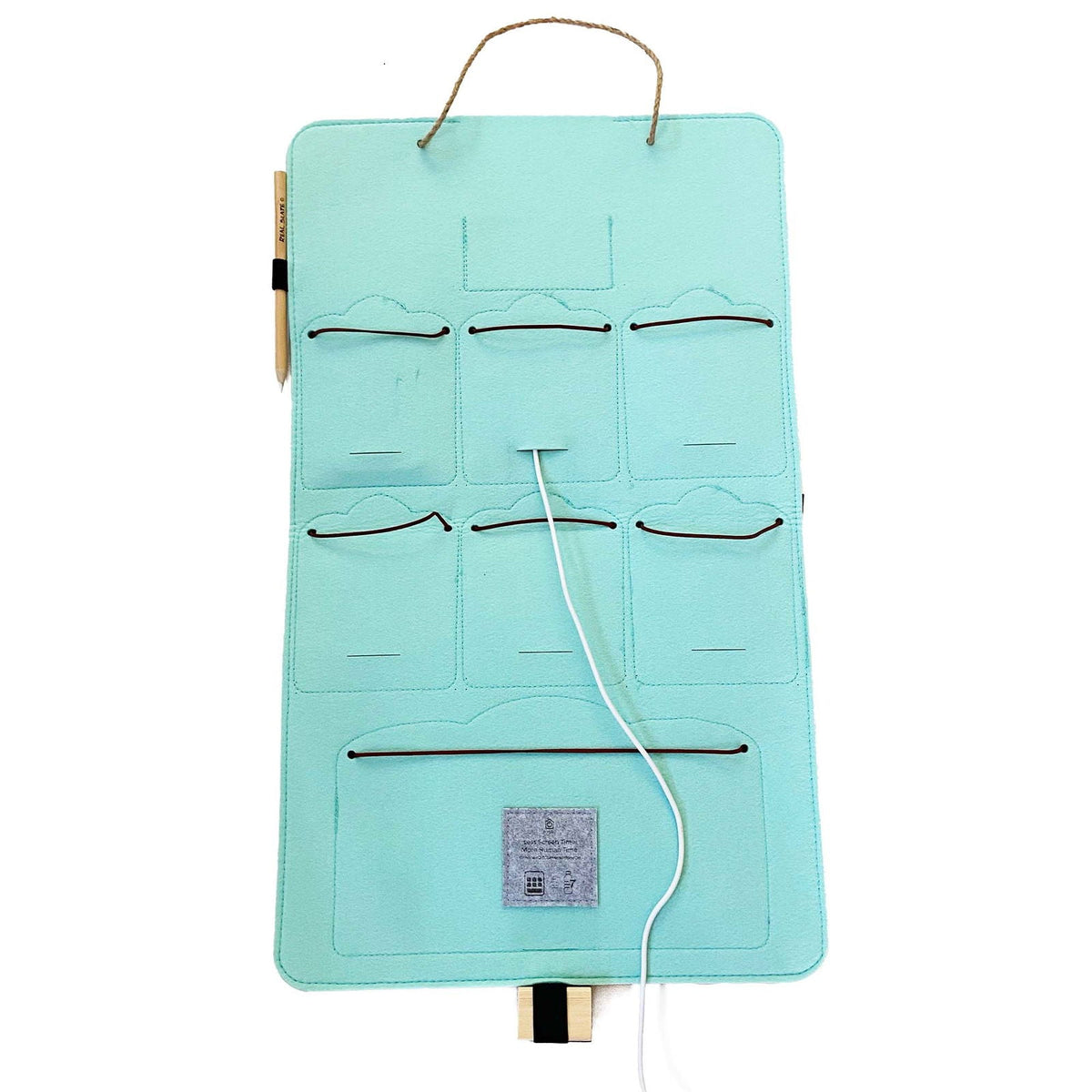 Interior view of a mint-green Bagby FAMILY organizer showing empty pockets, elastic cord closures and a charging cable routed through.