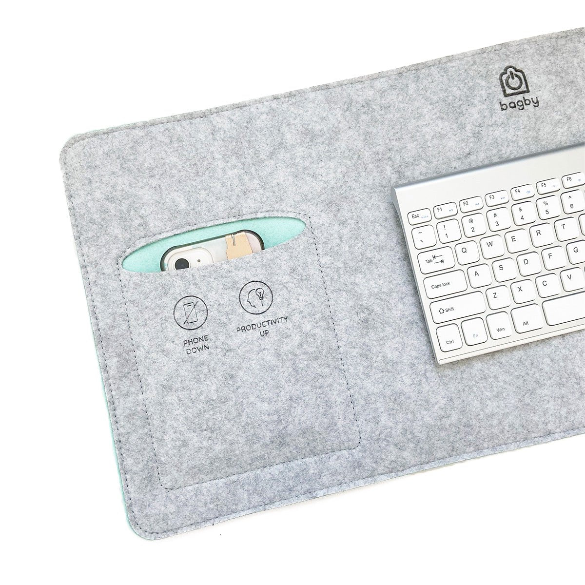 Close-up of the Bagby MAT's gray felt pocket holding a phone, with "phone down" and "productivity up" icons stitched below.