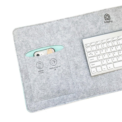 Close-up of the Bagby MAT's gray felt pocket holding a phone, with "phone down" and "productivity up" icons stitched below.