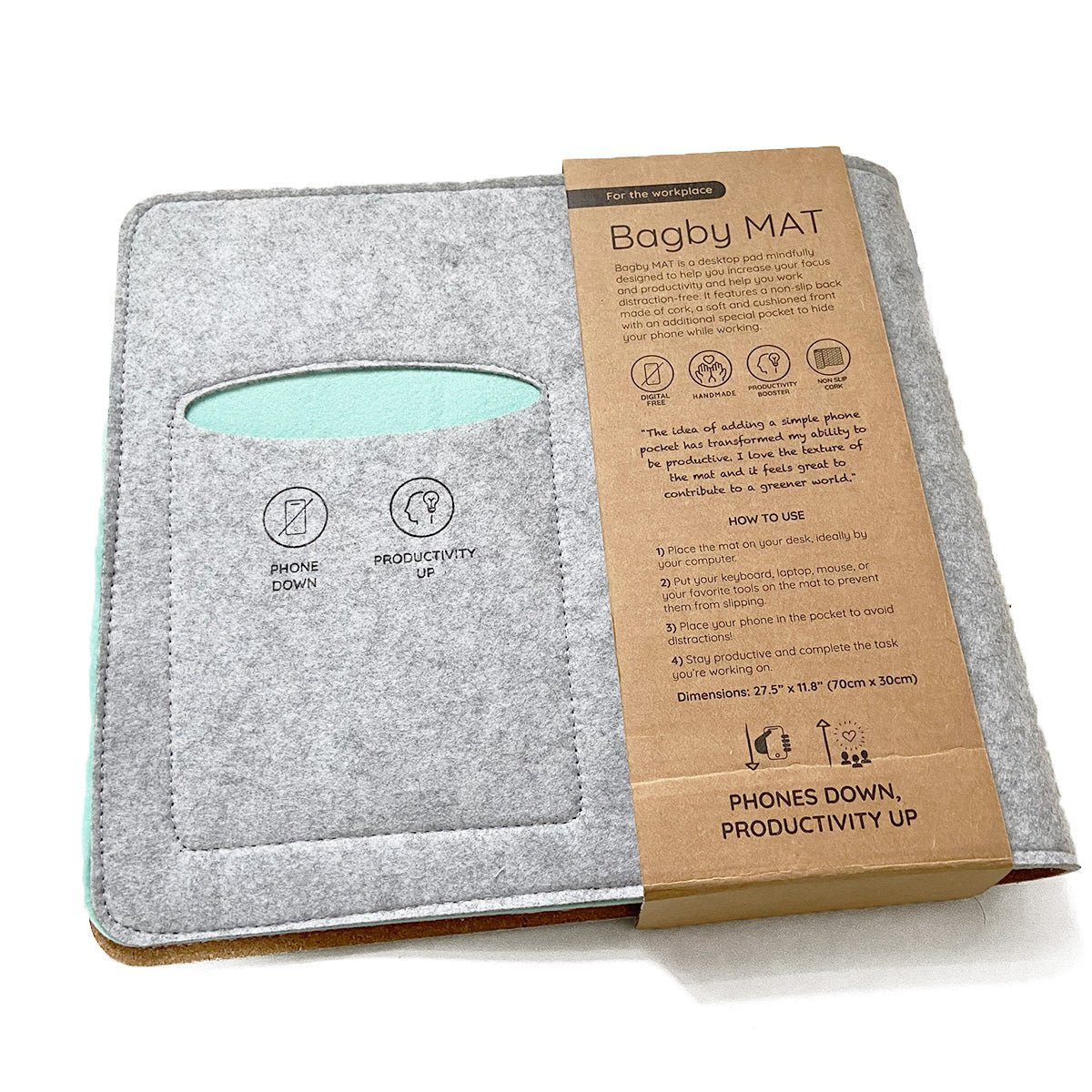 Bagby MAT desk pad in Gray/Mint shown open beside its kraft cardboard packaging printed with product details and instructions.