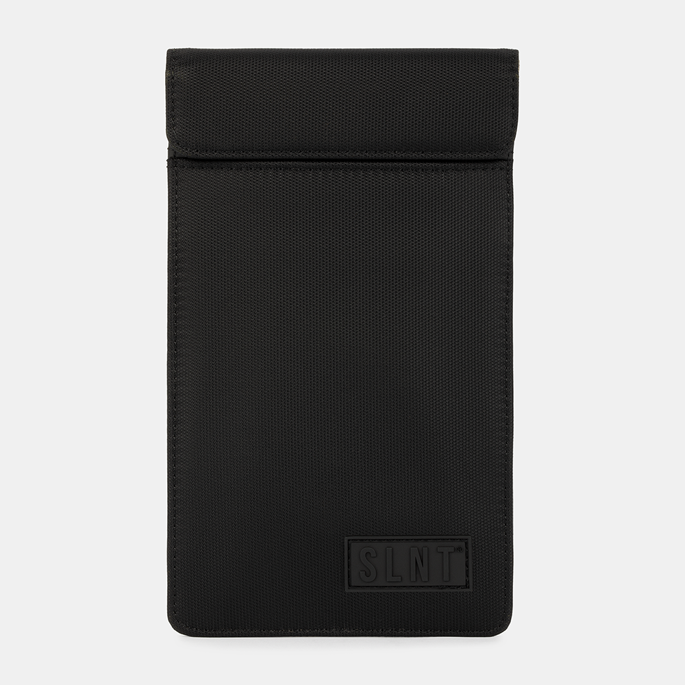 Black SLNT Faraday Phone Sleeve displayed flat against white background, showing front view with embossed logo and fold-over flap closure.