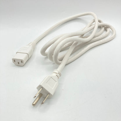 White power cord with a straight three-prong grounded plug and a C13 connector, loosely coiled on a white surface.