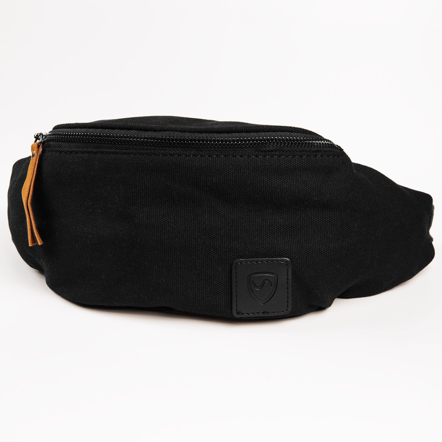 Black canvas SYB Cross Body Fanny Pack with orange zipper pull and embossed logo patch, front view against white background.