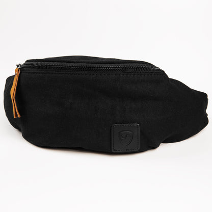 Black canvas SYB Cross Body Fanny Pack with orange zipper pull and embossed logo patch, front view against white background.