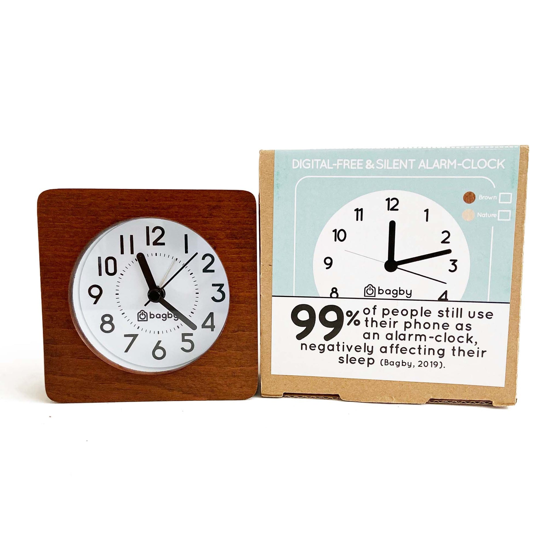 Bagby Classic Silent Alarm Clock in wood finish displayed next to its packaging showing product features and sleep health statistics.