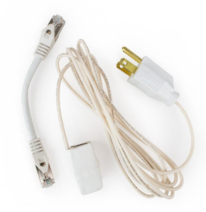 White Ethernet grounding adapter kit laid out with a short shielded patch cable, the grounding adapter and a coiled grounding cord with a three-prong plug.