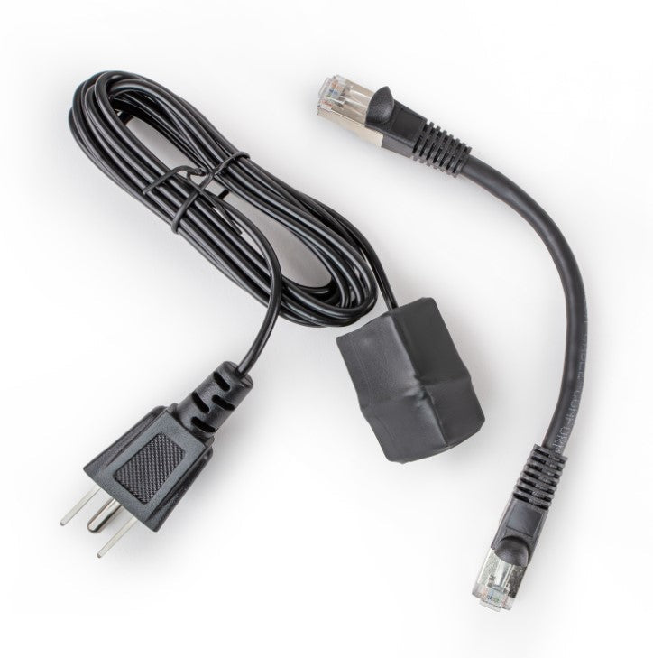Black Ethernet grounding adapter kit with a coiled grounding cord and three-prong plug, the adapter and a short shielded patch cable.