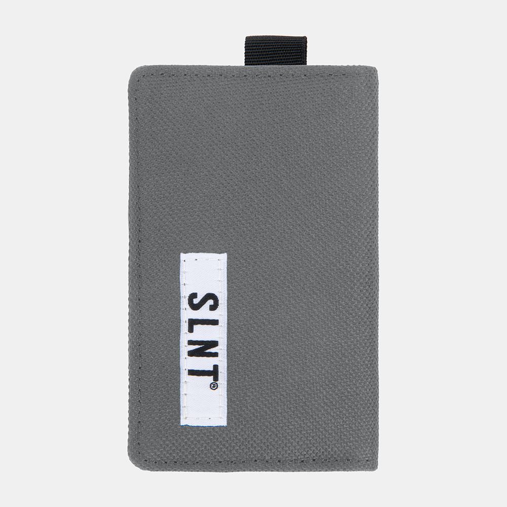 Gray Faraday Key Fob Bag with white brand label and black pull strap, front view.