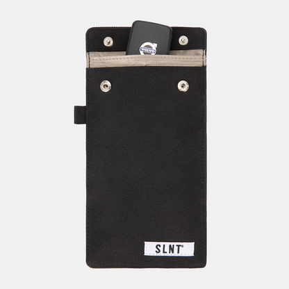 Black Faraday Key Fob Bag with Volvo key fob inside top pocket, showing front view with SLNT label and metal snaps.