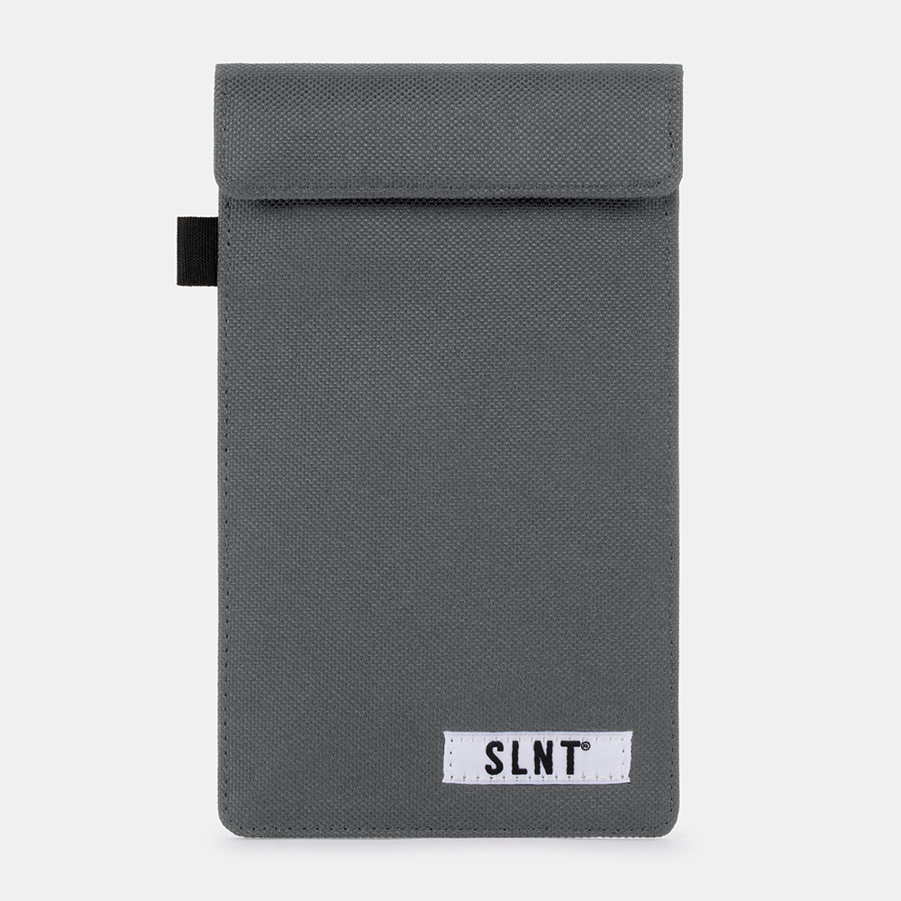 Gray fabric Faraday Key Fob Bag with black carry handle and SLNT branded label, front view against white background.