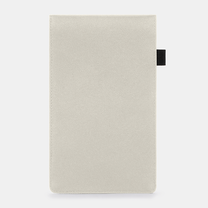 Faraday Key Fob Bag in cream with black fabric pull tab, front view against light background.