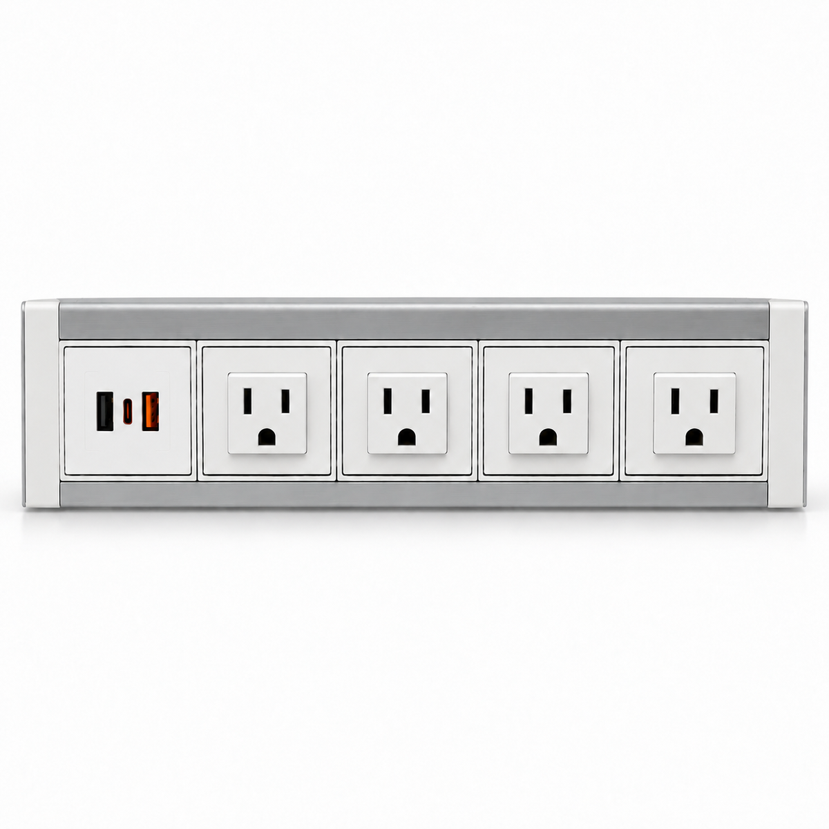 White and silver metal power dock with four AC outlets and a USB charging panel, resting on a light wood desk.