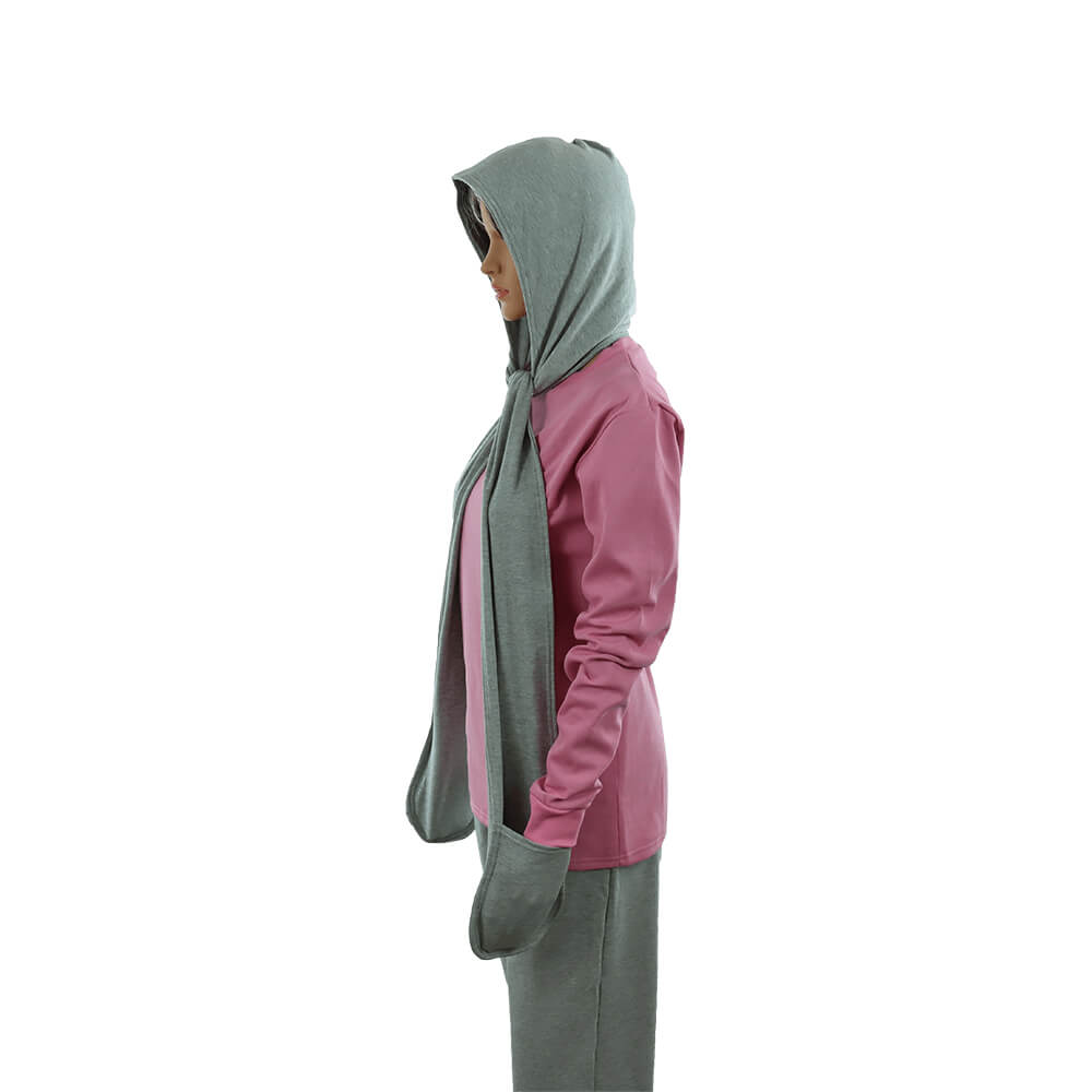 Side view of woman wearing LessEMF Hooded Scarf with Pockets in sage green and mauve, showing hood and draped scarf detail.