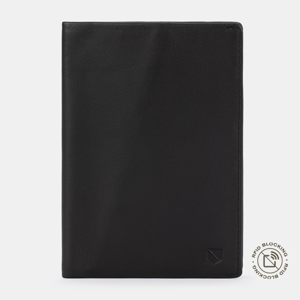 Black leather SLNT RFID Passport Wallet front view with RFID blocking logo in bottom right corner against light gray background.