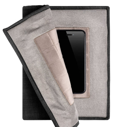 PoM Shield ORIGINAL Faraday cage opened to display smartphone inside protective compartment with fabric flap partially pulled back.