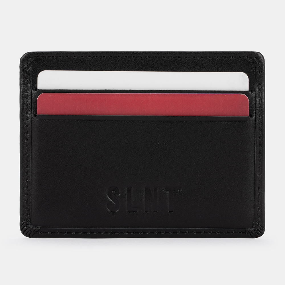 SLNT RFID Wallet front view displaying card slots with white and red cards inserted into black leather wallet.