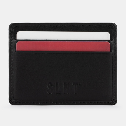 SLNT RFID Wallet front view displaying card slots with white and red cards inserted into black leather wallet.