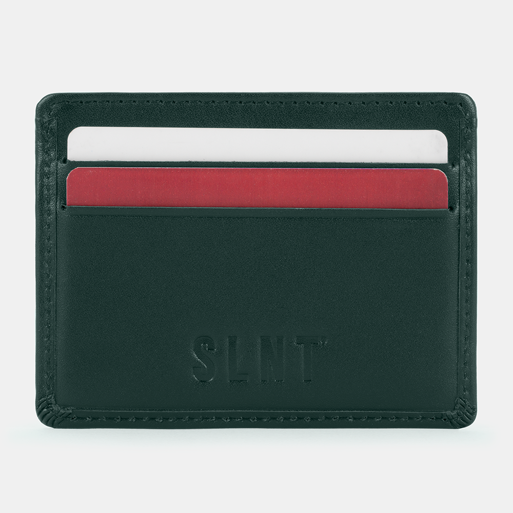 SLNT RFID Wallet in dark green leather with white and red card slots visible, front view.