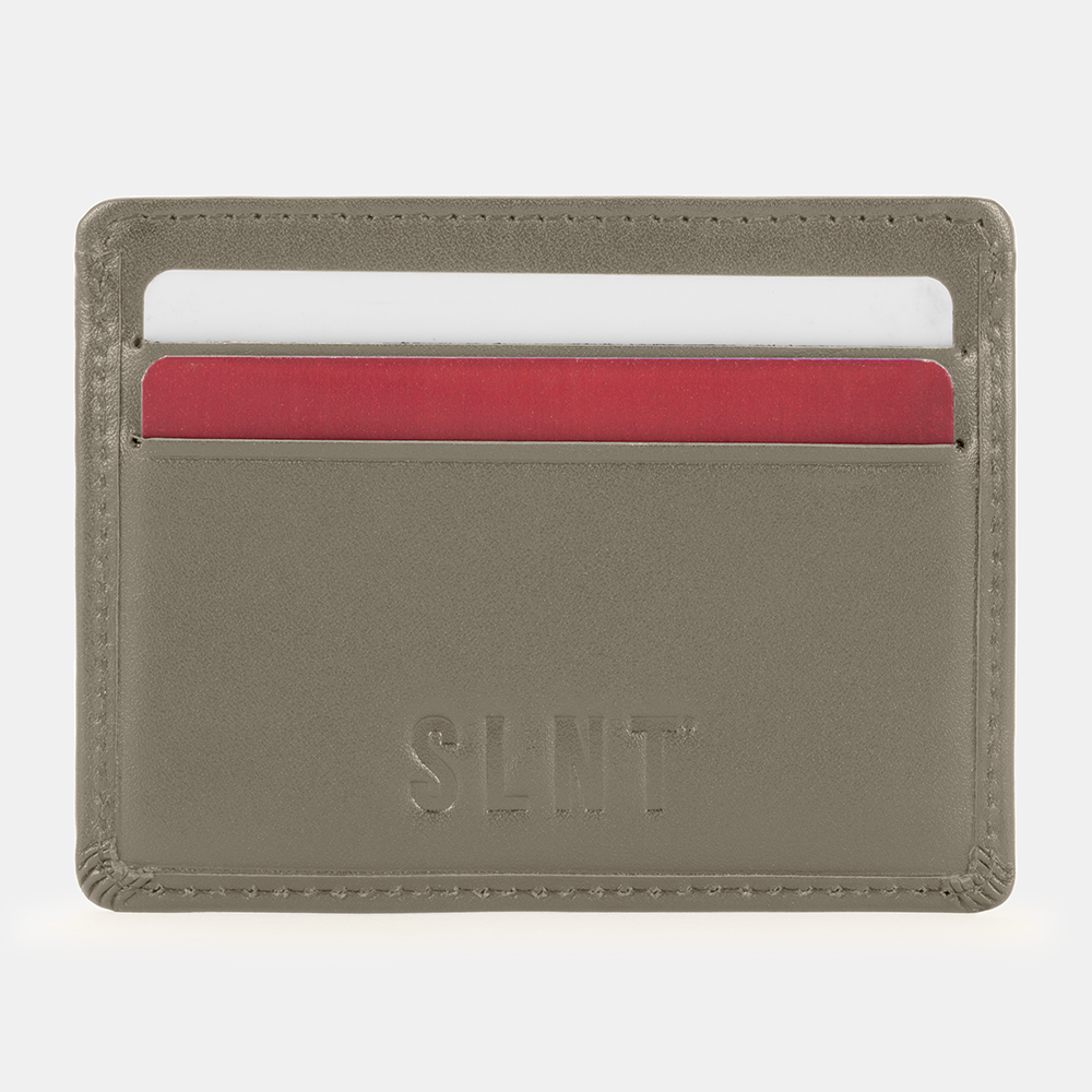 SLNT RFID Wallet in taupe with red and white card slots visible, front view showing card storage capacity.