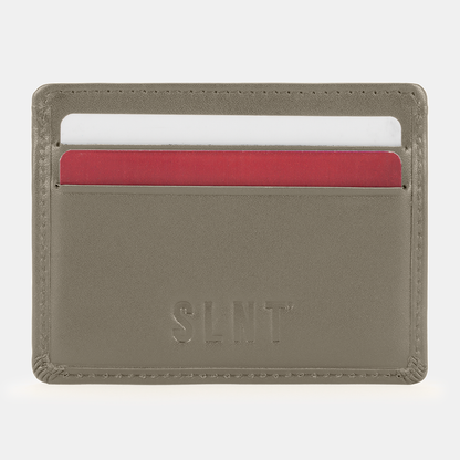 SLNT RFID Wallet in taupe with red and white card slots visible, front view showing card storage capacity.