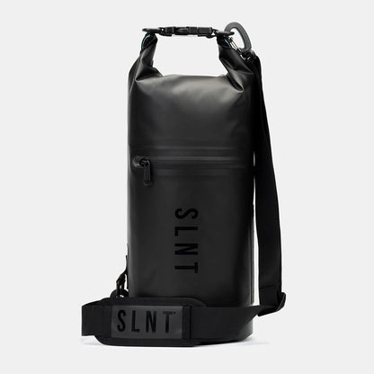 Black SLNT Faraday Dry Bag with rolled top handles, front zipper pocket, shoulder strap, and SLNT branding displayed against white background.