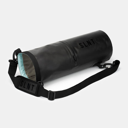 SLNT Faraday Dry Bag with black nylon strap and light blue interior lining displayed at an angle on white background.