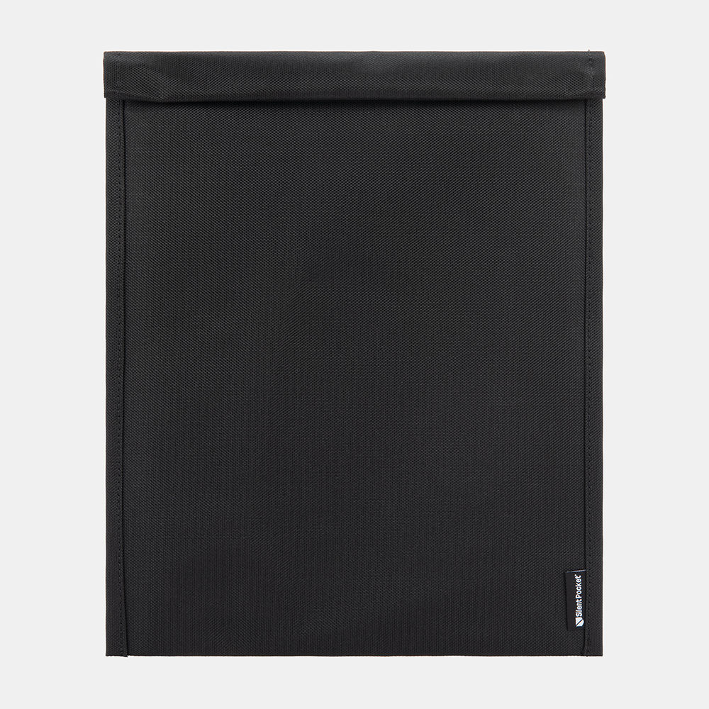 SLNT Faraday Laptop Bag closed flat lay view showing black textured fabric exterior with brand label on lower right corner.