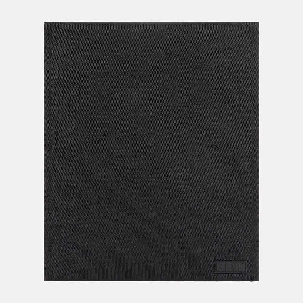 SLNT Faraday Laptop Bag in black with diagonal texture pattern and embossed logo on lower right corner, flat lay view.