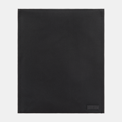 SLNT Faraday Laptop Bag in black with diagonal texture pattern and embossed logo on lower right corner, flat lay view.