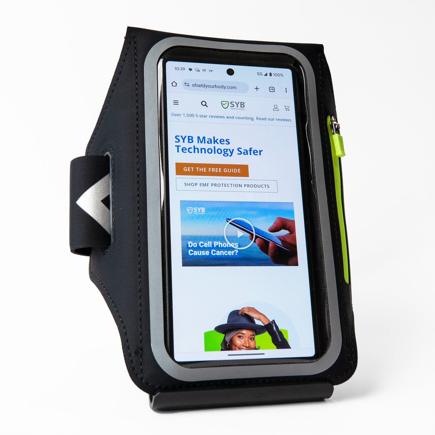 SYB Arm Band Phone Pouch in black holding a smartphone displaying the Shield Your Body website homepage.
