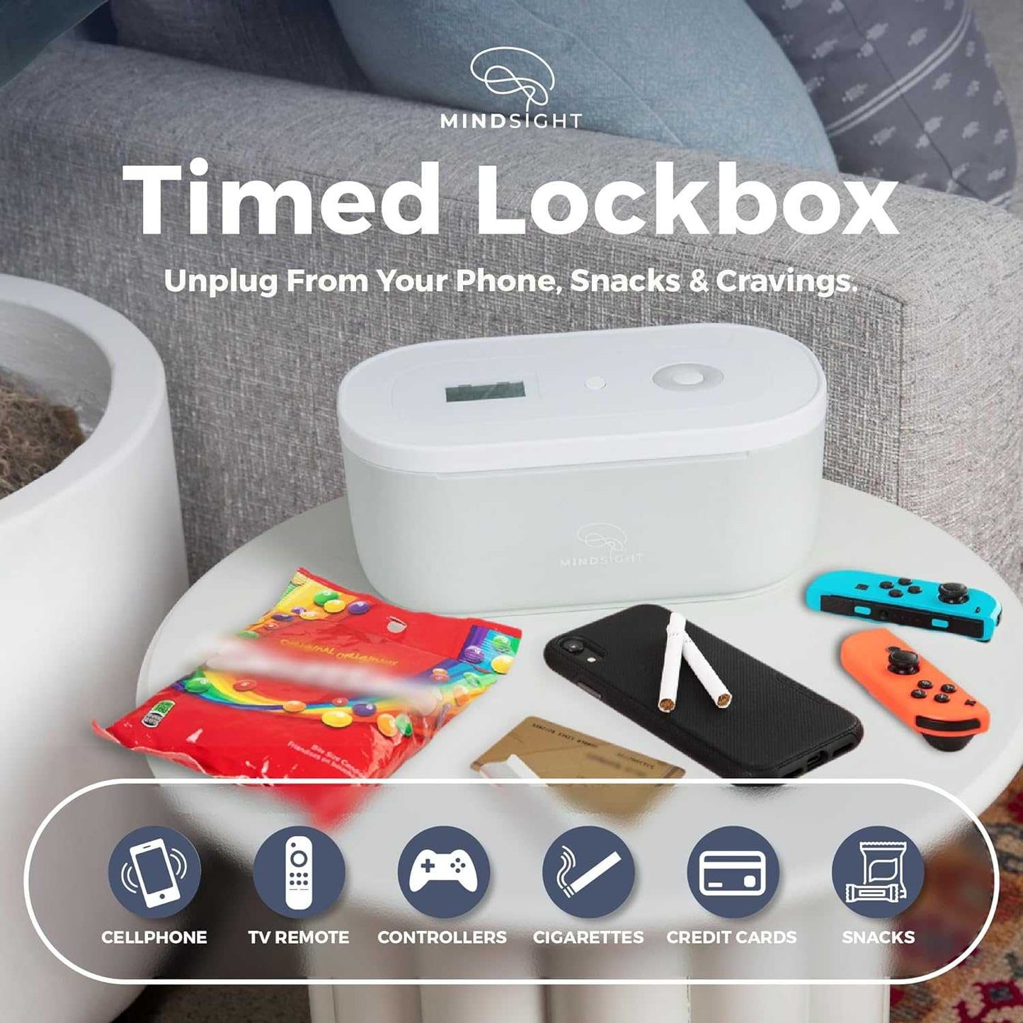 Mindsight Timed Lockbox displayed with phones, snacks, controllers, and other items it can secure, showing various categories it holds.