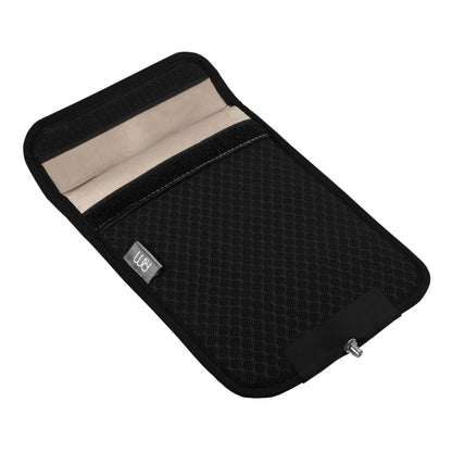 PoM Shield ECO Phone Faraday Cage open flat lay showing black exterior mesh, beige interior lining, and branded label.