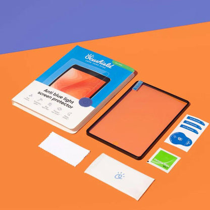 Ocushield Blue Light Screen Protector packaging and contents displayed flat on orange background, showing box, protective film, application cloths, and instruction cards.