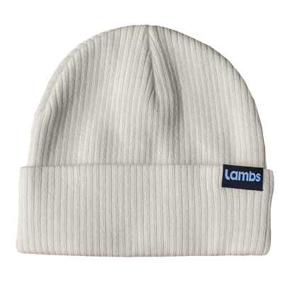 Cream ribbed HAVN WaveStopper™ Beanie with black brand label patch on fold, displayed flat against white background.