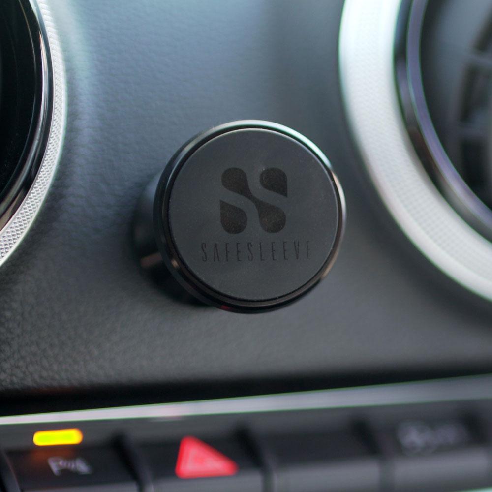 SafeSleeve car mount with logo mounted on vehicle dashboard between air vents.