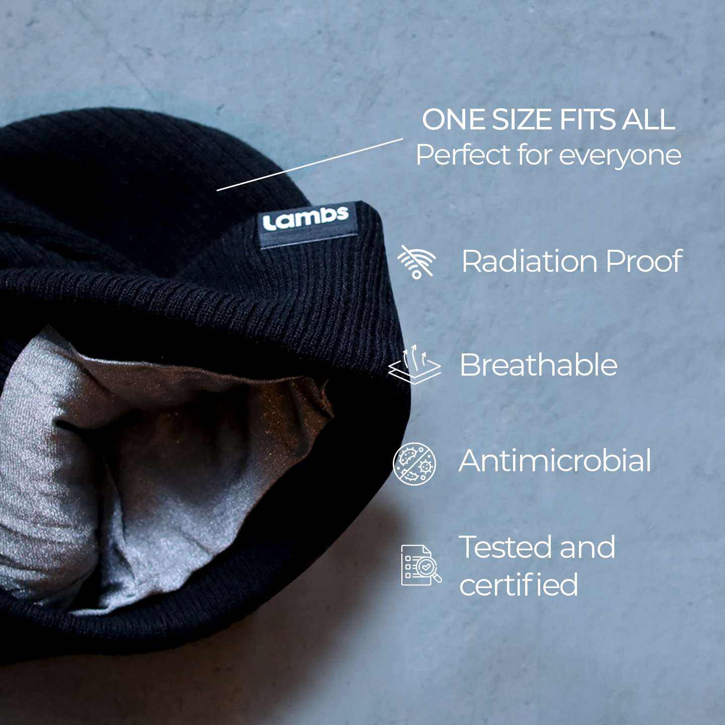 Black HAVN WaveStopper™ Beanie with gray lining displayed flat, showing product features: one size fits all, radiation proof, breathable, antimicrobial, tested and certified.