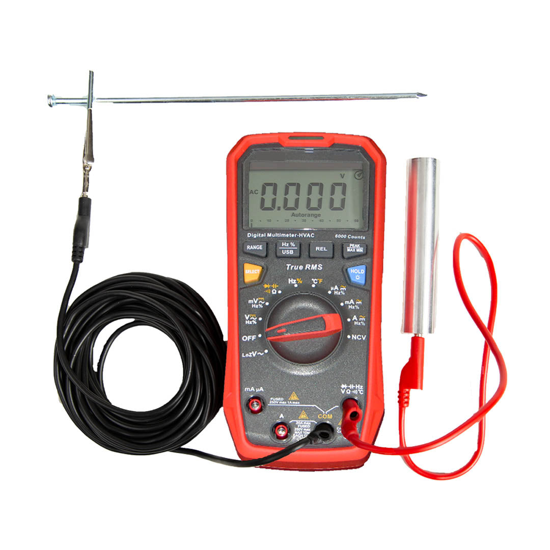 SLT Safe & Sound Body Voltage Home Test Kit with digital multimeter, black probe cable, red test leads, and metal cylinder accessory displayed together.