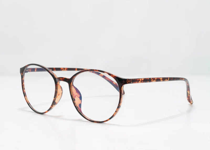 Ocushield Clear blue light glasses with tortoiseshell frame pattern, angled front view on white background.