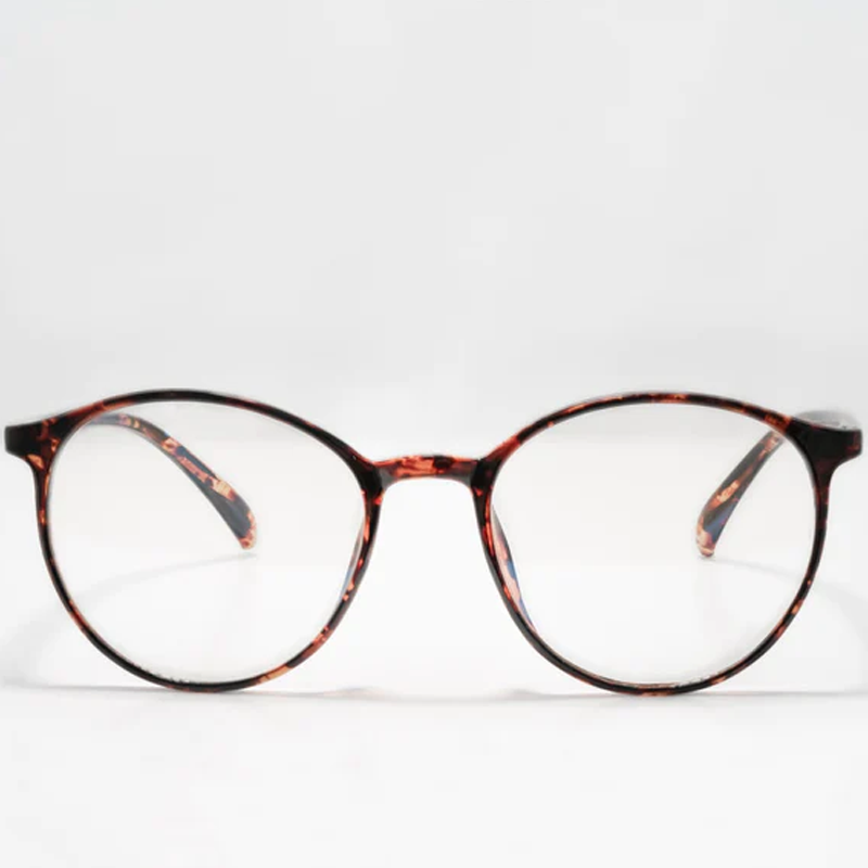 Ocushield Clear All-Day Blue Light Glasses in tortoiseshell pattern, front view against white background.