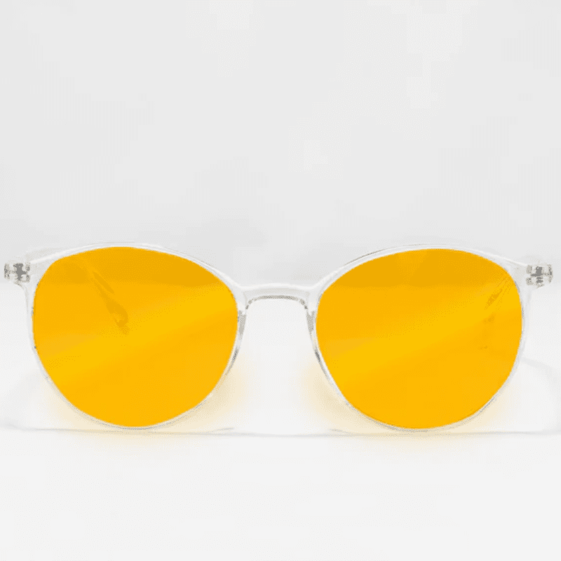 Ocushield Amber blue light glasses with clear frame and bright yellow-orange lenses, front view against white background.